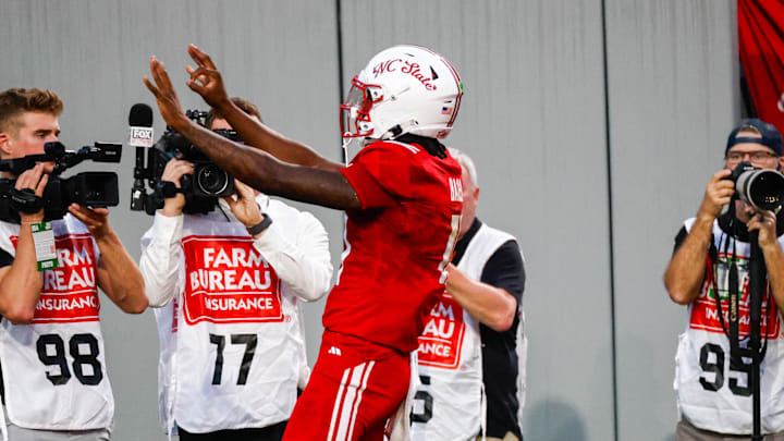 Aug 28, 2025; Raleigh, North Carolina, USA; North Carolina State Wolfpack quarterback CJ Bailey (11) celebrates a touchdown during the first half of the game against East Carolina Pirates at Carter-Finley Stadium. Mandatory Credit: Jaylynn Nash-Imagn Images Aug 28, 2025; Raleigh, North Carolina, USA; North Carolina State Wolfpack quarterback CJ Bailey (11) celebrates a touchdown during the first half of the game against East Carolina Pirates at Carter-Finley Stadium. Mandatory Credit: Jaylynn Nash-Imagn Images