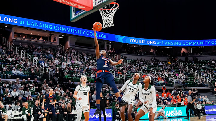 Illinois guard Destiny Jackson (2) finishes at the rim in the Illini's 81-75 loss to Michigan State at the Breslin Center in East Lansing, Michigan.