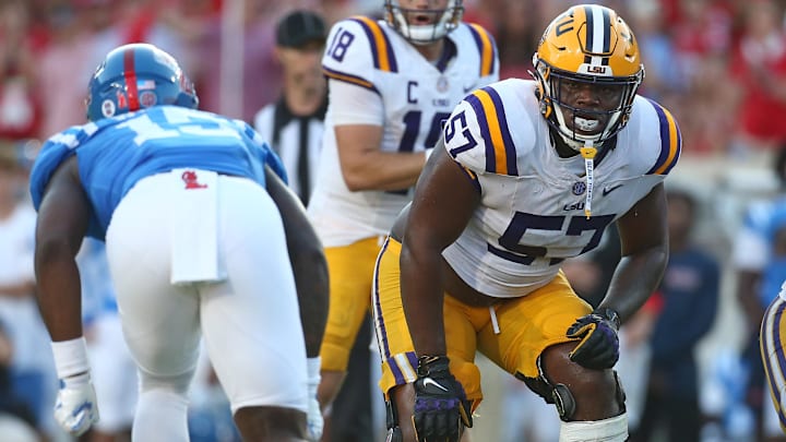 LSU Tigers offensive lineman Carius Curne (57) waits for the snap during the fourth quarter against the Mississippi Rebels at Vaught-Hemingway Stadium. LSU Tigers offensive lineman Carius Curne (57) waits for the snap during the fourth quarter against the Mississippi Rebels at Vaught-Hemingway Stadium.