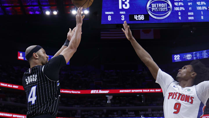 Apr 19, 2026; Detroit, Michigan, USA; Orlando Magic guard Jalen Suggs (4) shoots the ball against Detroit Pistons forward Ausar Thompson (9) in the first half during the 2026 NBA Playoffs at Little Caesars Arena. Mandatory Credit: Rick Osentoski-Imagn Images