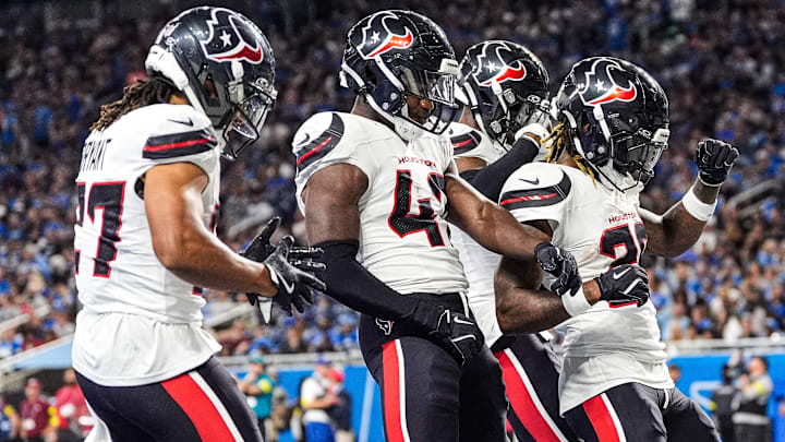 Houston Texans cornerback Jalen Mills (26), center, celebrates an interception against the Detroit Lions during the second half at Ford Field in Detroit on Saturday, August 23, 2025.
