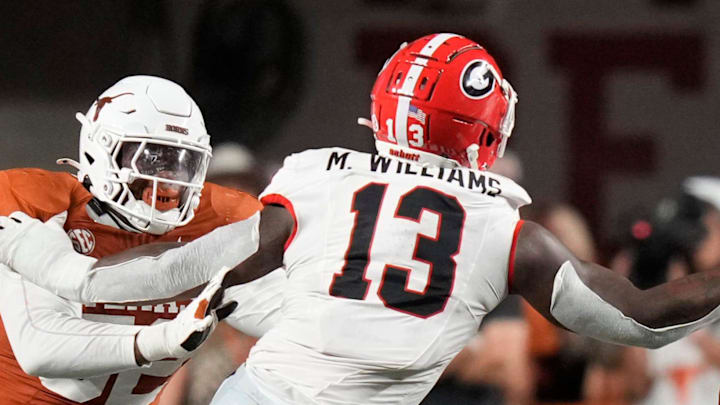 Georgia Bulldogs defensive lineman Mykel Williams face masks Texas Longhorns quarterback Arch Manning in the second quarter at Darrell K Royal-Texas Memorial Stadium Saturday October 19, 2024.