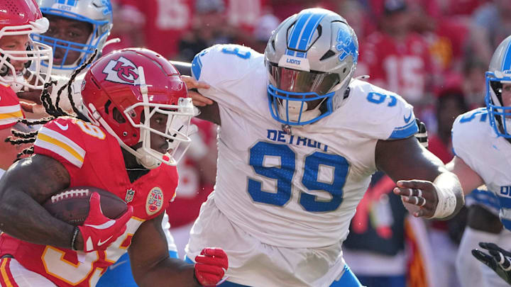 Kansas City Chiefs running back Emani Bailey (39) runs the ball as Detroit Lions defensive tackle Brodric Martin (99) defends