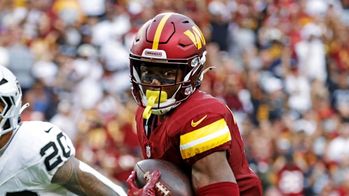 Sep 21, 2025; Landover, Maryland, USA; Washington Commanders wide receiver Terry McLaurin (17) runs the ball during the second half as Las Vegas Raiders safety Isaiah Pola-Mao (20) defends at Northwest Stadium. Mandatory Credit: Amber Searls-Imagn Images Sep 21, 2025; Landover, Maryland, USA; Washington Commanders wide receiver Terry McLaurin (17) runs the ball during the second half as Las Vegas Raiders safety Isaiah Pola-Mao (20) defends at Northwest Stadium. Mandatory Credit: Amber Searls-Imagn Images