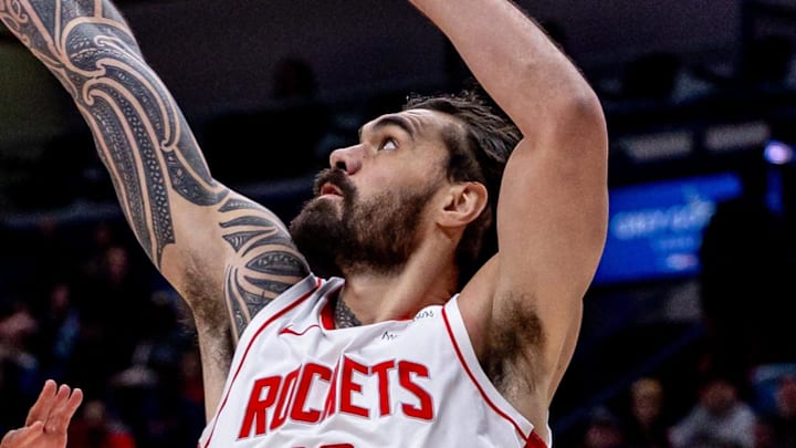 Mar 6, 2025; New Orleans, Louisiana, USA;  New Orleans Pelicans guard CJ McCollum (3) shoots a jump shot against Houston Rockets center Steven Adams (12) during the first half at Smoothie King Center. Mandatory Credit: Stephen Lew-Imagn Images