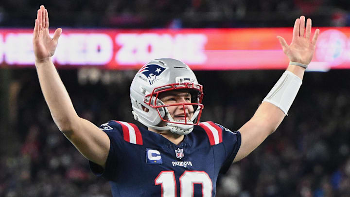 Jan 4, 2026; Foxborough, Massachusetts, USA; New England Patriots quarterback Drake Maye (10) reacts to a Patriots touchdown scored against the Miami Dolphins during the first quarter at Gillette Stadium. Mandatory Credit: Brian Fluharty-Imagn Images