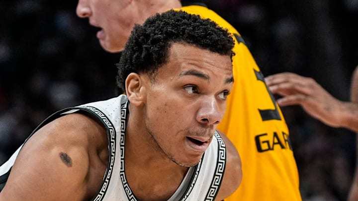 Michigan State guard Divine Ugochukwu (99) dribbles against Oakland during the second half at Little Caesars Arena in Detroit on Saturday, Dec. 20, 2025.