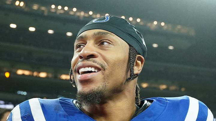 Indianapolis Colts running back Jonathan Taylor greets a coach after a game
