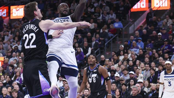 Jan 20, 2026; Salt Lake City, Utah, USA; Minnesota Timberwolves forward Julius Randle (30) goes to the basket against Utah Jazz forward Kyle Filipowski (22) during the second half at Delta Center. Mandatory Credit: Rob Gray-Imagn Images