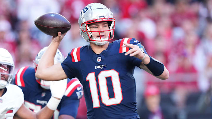 Dec 15, 2024; Glendale, Arizona, USA; New England Patriots quarterback Drake Maye (10) throws against the Arizona Cardinals during the first half at State Farm Stadium. Mandatory Credit: Joe Camporeale-Imagn Images