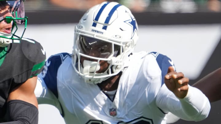 Oct 5, 2025; East Rutherford, New Jersey, USA; New York Jets quarterback Justin Fields (7) is pressured by Dallas Cowboys defensive end Dante Fowler Jr. (13) during the first half at MetLife Stadium. Mandatory Credit: Robert Deutsch-Imagn Images Oct 5, 2025; East Rutherford, New Jersey, USA; New York Jets quarterback Justin Fields (7) is pressured by Dallas Cowboys defensive end Dante Fowler Jr. (13) during the first half at MetLife Stadium. Mandatory Credit: Robert Deutsch-Imagn Images