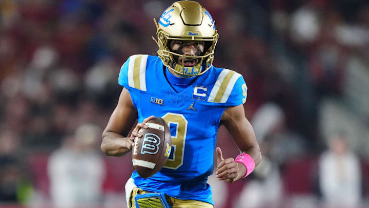 Nov 29, 2025; Los Angeles, California, USA; UCLA Bruins quarterback Nico Iamaleava (9) carries the ball against the Southern California Trojans in the first half at United Airlines Field at Los Angeles Memorial Coliseum. Mandatory Credit: Kirby Lee-Imagn Images