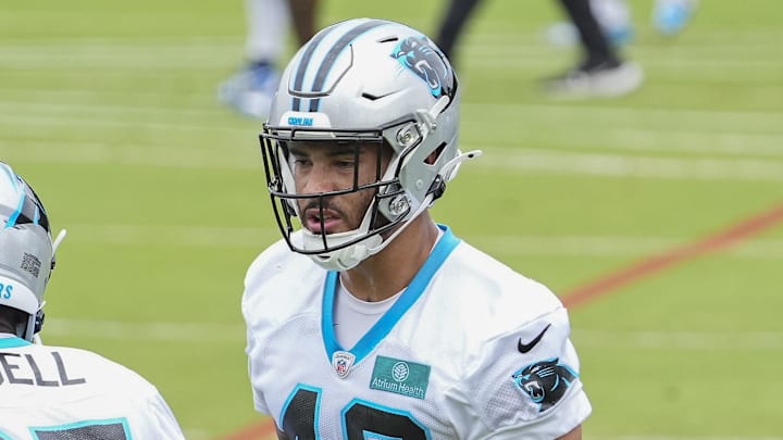 Jun 4, 2024; Charlotte, NC, USA; Carolina Panthers safety Clayton Isbell (35) and linebacker Jackson Mitchell (49) during OTAs. Mandatory Credit: Jim Dedmon-Imagn Images