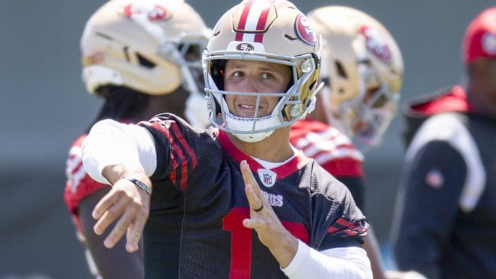 San Francisco 49ers quarterbacks Mac Jones (10) and Brock Purdy (13) work on passing drills during a team OTA at Levi's Stadium.