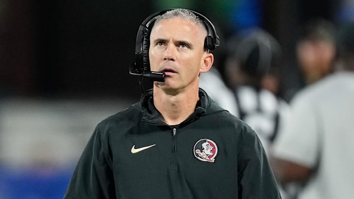 Dec 2, 2023; Charlotte, NC, USA;  Florida State Seminoles head coach Mike Norvell walks the sidelines during the third quarter against the Louisville Cardinals at Bank of America Stadium. Mandatory Credit: Jim Dedmon-Imagn Images