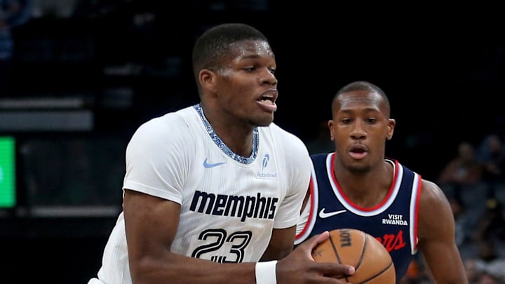 Dec 5, 2025; Memphis, Tennessee, USA; Memphis Grizzlies forward Cedric Coward (23) drives to the basket between Los Angeles Clippers forward John Collins (20) and guard Kris Dunn (8) during the first quarter at FedExForum. Mandatory Credit: Petre Thomas-Imagn Images Dec 5, 2025; Memphis, Tennessee, USA; Memphis Grizzlies forward Cedric Coward (23) drives to the basket between Los Angeles Clippers forward John Collins (20) and guard Kris Dunn (8) during the first quarter at FedExForum. Mandatory Credit: Petre Thomas-Imagn Images