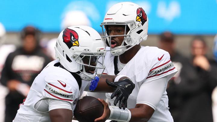 Sep 13, 2026; Inglewood, California, USA;  Arizona Cardinals quarterback Jacoby Brissett (7) hands off to running back Jeremiyah Love (4) against the Los Angeles Chargers during the first quarter at SoFi Stadium.  Mandatory Credit: Kiyoshi Mio-Imagn Images
