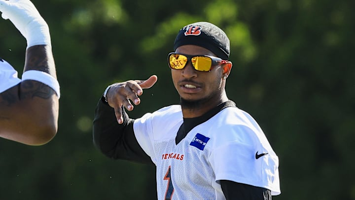 Jul 23, 2025; Cincinnati, OH, USA; Cincinnati Bengals wide receiver Ja'Marr Chase (1) and offensive tackle Orlando Brown Jr. (75) during training camp at Kettering Health Practice Field. Mandatory Credit: Katie Stratman-Imagn Images