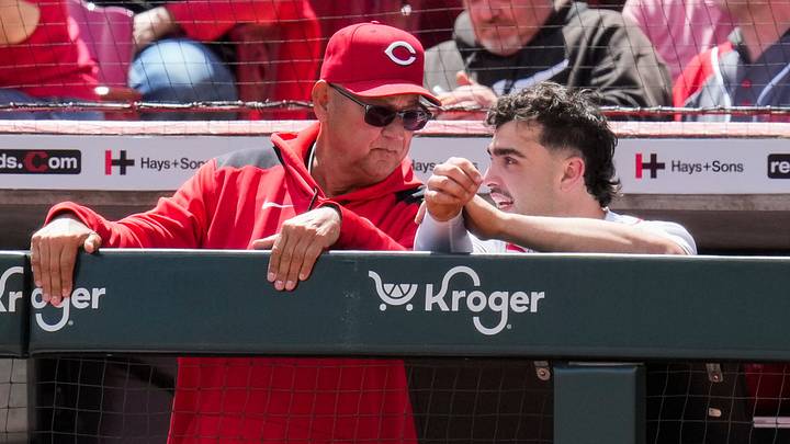 Cincinnati Reds first baseman Sal Stewart (27) checks in with manager Terry Francona (77) after scoring in the eighth inning of the MLB National League game between the Cincinnati Reds and the Colorado Rockies at Great American Ball Park in downtown Cincinnati on Thursday, April 30, 2026. The Reds won 6-4.
