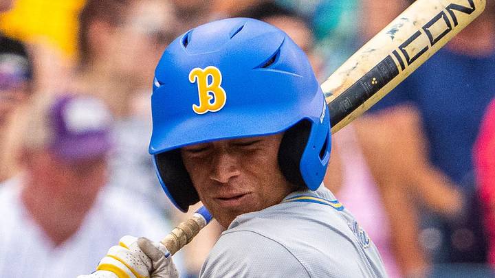 Jun 16, 2025; Omaha, Neb, USA; UCLA Bruins second baseman Phoenix Call (4) gets hit by a pitch during the second inning against the LSU Tigers at Charles Schwab Field. Mandatory Credit: Dylan Widger-Imagn Images