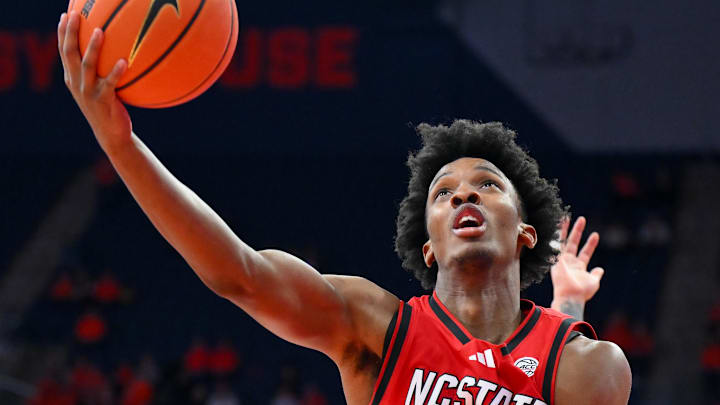 Feb 26, 2025; Syracuse, New York, USA; North Carolina State Wolfpack guard Paul McNeil (2) shoots in front of Syracuse Orange guard Jaquan Carlos (right) during the second half at the JMA Wireless Dome. Mandatory Credit: Rich Barnes-Imagn Images Feb 26, 2025; Syracuse, New York, USA; North Carolina State Wolfpack guard Paul McNeil (2) shoots in front of Syracuse Orange guard Jaquan Carlos (right) during the second half at the JMA Wireless Dome. Mandatory Credit: Rich Barnes-Imagn Images