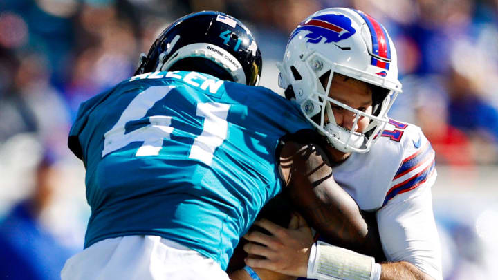 Nov 7, 2021; Jacksonville, Florida, USA;  Jacksonville Jaguars outside linebacker Josh Allen (41) sacks Buffalo Bills quarterback Josh Allen (17) in the first half at TIAA Bank Field. Mandatory Credit: Nathan Ray Seebeck-USA TODAY Sports