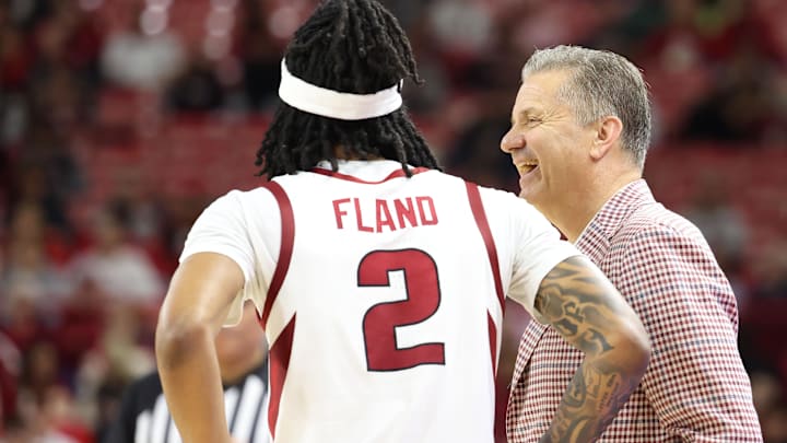 Dec 21, 2024; Fayetteville, Arkansas, USA; Arkansas Razorbacks head coach John Calipari and guard Boogie Fland during the second half against the North Carolina A&T Aggies at Bud Walton Arena. Mandatory Credit: Nelson Chenault-Imagn Images