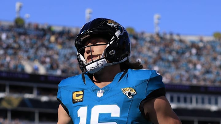 Jacksonville Jaguars quarterback Trevor Lawrence (16) scores a touchdown on a keeper during the first quarter of an NFL football matchup at EverBank Stadium, Sunday, Dec. 14, 2025, in Jacksonville, Fla. The Jaguars defeated the Jets 48-20.