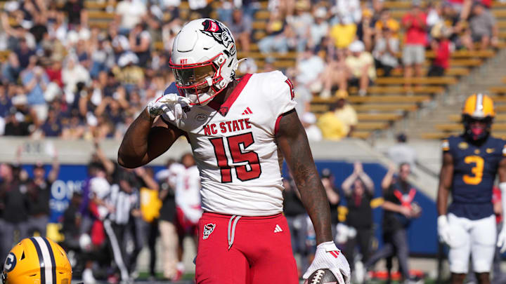 Oct 19, 2024; Berkeley, California, USA; North Carolina State Wolfpack tight end Justin Joly (15) gestures after catching a pass against California Golden Bears defensive back Cam Sidney (20) during the second quarter at California Memorial Stadium. Mandatory Credit: Darren Yamashita-Imagn Images