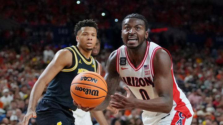 Apr 4, 2026; Indianapolis, IN, USA; Arizona Wildcats guard Jaden Bradley (0) drives to the basket during the first half in a semifinal of the Final Four of the men's 2026 NCAA Tournament at Lucas Oil Stadium. Mandatory Credit: Bob Donnan-Imagn Images