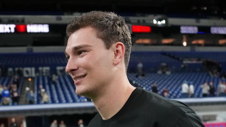 Feb 28, 2026; Indianapolis, IN, USA; Indiana quarterback Fernando Mendoza (QB11) looks on during the NFL Scouting Combine at Lucas Oil Stadium. Mandatory Credit: Kirby Lee-Imagn Images