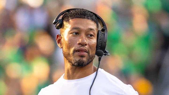 Oct 4, 2025; South Bend, Indiana, USA; Notre Dame head football coach Marcus Freeman adjusts his radio against the Boise State Broncos at Notre Dame Stadium. Oct 4, 2025; South Bend, Indiana, USA; Notre Dame head football coach Marcus Freeman adjusts his radio against the Boise State Broncos at Notre Dame Stadium.