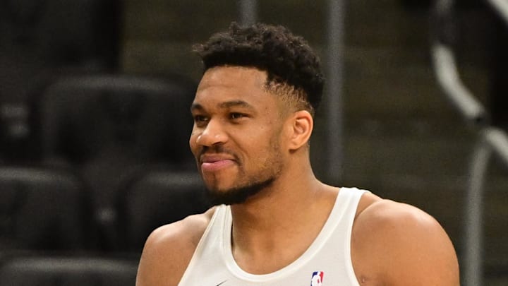 Milwaukee Bucks forward Giannis Antetokounmpo (34) talks to Dallas Mavericks head coach Jason Kidd (left) before a game at Fiserv Forum on March 31, 2026.