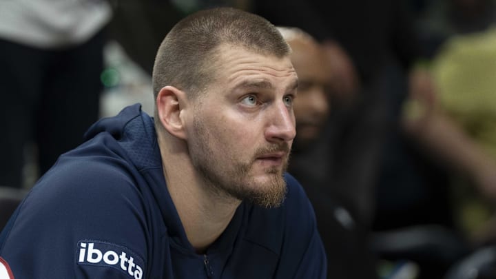 Apr 30, 2026; Minneapolis, Minnesota, USA; Denver Nuggets center Nikola Jokic (15) seats on the bench before the second half begins against the Minnesota Timberwolves during game six of the first round of the 2026 NBA Playoffs at Target Center. Mandatory Credit: Jesse Johnson-Imagn Images