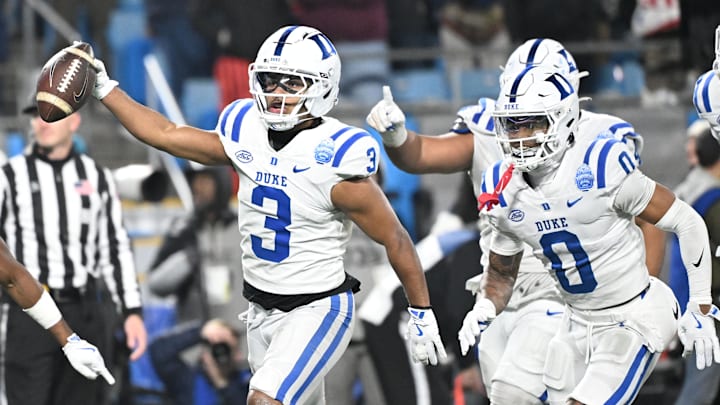Dec 6, 2025; Charlotte, NC, USA; Duke Blue Devils defensive back Caleb Weaver (3) celebrates with teammates after making a interception in the fourth quarter during the ACC Championship game at Bank of America Stadium. Mandatory Credit: Bob Donnan-Imagn Images Dec 6, 2025; Charlotte, NC, USA; Duke Blue Devils defensive back Caleb Weaver (3) celebrates with teammates after making a interception in the fourth quarter during the ACC Championship game at Bank of America Stadium. Mandatory Credit: Bob Donnan-Imagn Images