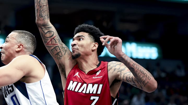 Feb 13, 2025; Dallas, Texas, USA; Dallas Mavericks guard Dante Exum (0) drives to the basket past Miami Heat center Kel'el Ware (7) during the first half at American Airlines Center. Mandatory Credit: Kevin Jairaj-Imagn Images Feb 13, 2025; Dallas, Texas, USA; Dallas Mavericks guard Dante Exum (0) drives to the basket past Miami Heat center Kel'el Ware (7) during the first half at American Airlines Center. Mandatory Credit: Kevin Jairaj-Imagn Images
