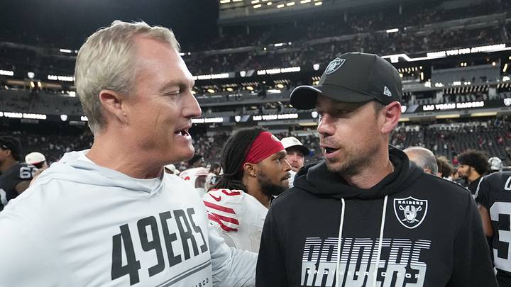 San Francisco 49ers president of football operations John Lynch (left) chats with Las Vegas Raiders head coach Klint Kubiak (right) San Francisco 49ers president of football operations John Lynch (left) chats with Las Vegas Raiders head coach Klint Kubiak (right)