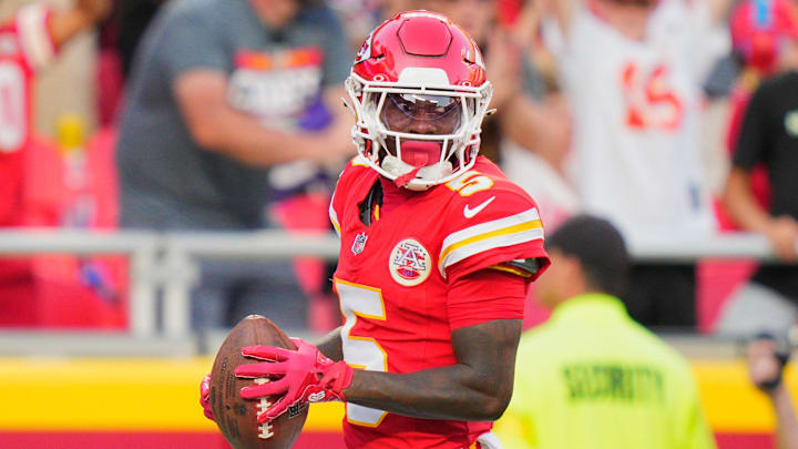 Sep 28, 2025; Kansas City, Missouri, USA; Kansas City Chiefs wide receiver Hollywood Brown (5) scores a touchdown during the fourth quarter against the Baltimore Ravens at GEHA Field at Arrowhead Stadium. Mandatory Credit: Jay Biggerstaff-Imagn Images