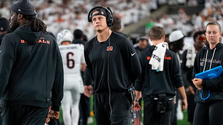 Injured Cincinnati Bengals quarterback Joe Burrow (9) walks the sideline with a headset in the second quarter of the NFL Week 7 game between the Cincinnati Bengals and the Pittsburgh Steelers at Paycor Stadium in downtown Cincinnati on Thursday, Oct. 16, 2025. Injured Cincinnati Bengals quarterback Joe Burrow (9) walks the sideline with a headset in the second quarter of the NFL Week 7 game between the Cincinnati Bengals and the Pittsburgh Steelers at Paycor Stadium in downtown Cincinnati on Thursday, Oct. 16, 2025.