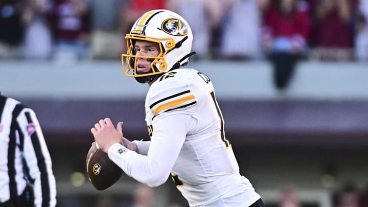 Missouri Tigers quarterback Brady Cook scrambles against the Mississippi State Bulldogs during the second quarter last Saturday in Starkville, Miss. Cook led No. 23 Mizzou to a 39-20 victory.