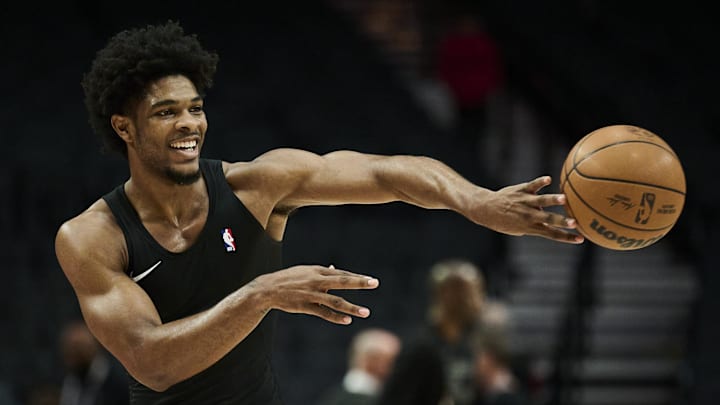 Feb 6, 2025; Portland, Oregon, USA; Portland Trail Blazers guard Scoot Henderson (00) warms ups before a game against the Sacramento Kings at Moda Center. Mandatory Credit: Troy Wayrynen-Imagn Images