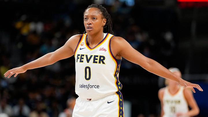 Kelsey Mitchell 0 of the Indiana Fever looks on during the first half of a game. Kelsey Mitchell 0 of the Indiana Fever looks on during the first half of a game.