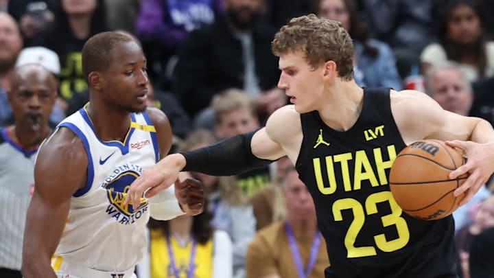 Oct 25, 2024; Salt Lake City, Utah, USA; Utah Jazz forward Lauri Markkanen (23) posts up on Golden State Warriors forward Jonathan Kuminga (00) during the second quarter at Delta Center. Mandatory Credit: Rob Gray-Imagn Images