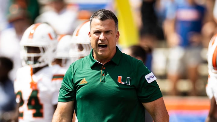 Aug 31, 2024; Gainesville, Florida, USA; Miami Hurricanes head coach Mario Cristobal reacts before a game against the Florida Gators at Ben Hill Griffin Stadium. Mandatory Credit: Matt Pendleton-Imagn Images
