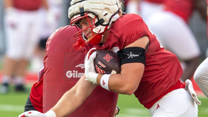 Nebraska tight end Carter Nelson runs through a block during a drill at the Big Red Preview on Saturday.