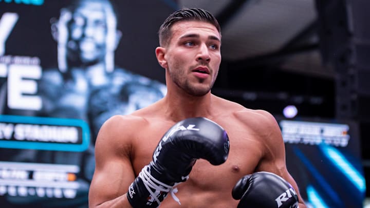 Tommy Fury hits pads with his father on April 18, 2022. Tommy Fury hits pads with his father on April 18, 2022.