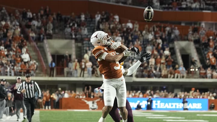 Texas Longhorns wide receiver Emmett Mosley V reaches for a pass during the first half against the Texas A&M Aggies