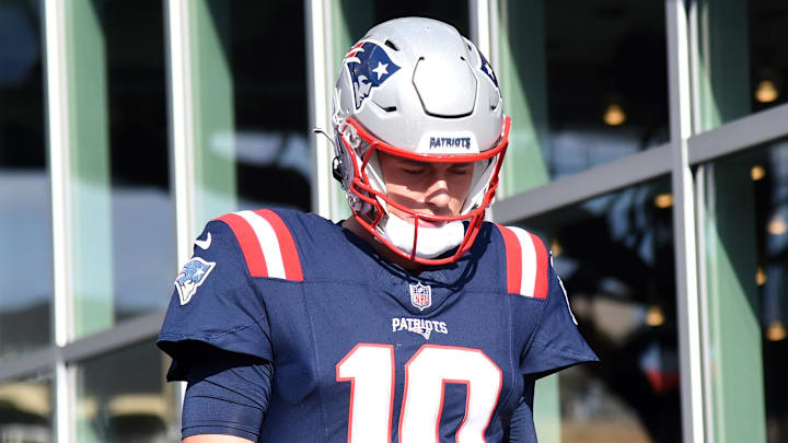 Nov 5, 2023; Foxborough, Massachusetts, USA; New England Patriots quarterback Mac Jones (10) walks to the field for pregame warmups prior to a game against the Washington Commanders at Gillette Stadium. Mandatory Credit: Bob DeChiara-Imagn Images