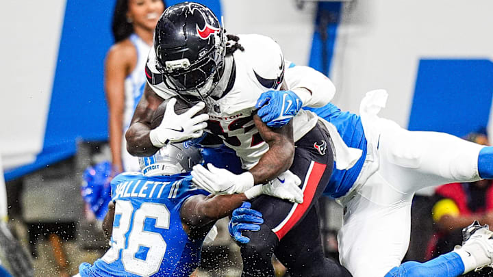 Houston Texans running back Dare Ogunbowale (33) makes a catch against Detroit Lions safety Erick Hallett (36) Houston Texans running back Dare Ogunbowale (33) makes a catch against Detroit Lions safety Erick Hallett (36)