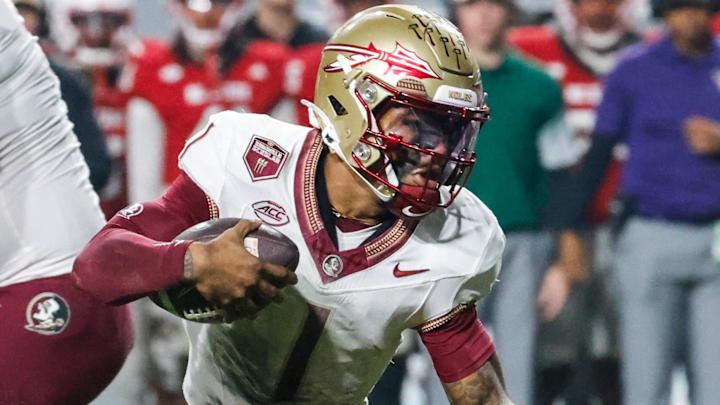Nov 21, 2025; Raleigh, North Carolina, USA; Florida State Seminoles quarterback Tommy Castellanos (1) runs with the ball during the second half of the game against NC State Wolfpack at Carter-Finley Stadium. Mandatory Credit: Jaylynn Nash-Imagn Images Nov 21, 2025; Raleigh, North Carolina, USA; Florida State Seminoles quarterback Tommy Castellanos (1) runs with the ball during the second half of the game against NC State Wolfpack at Carter-Finley Stadium. Mandatory Credit: Jaylynn Nash-Imagn Images